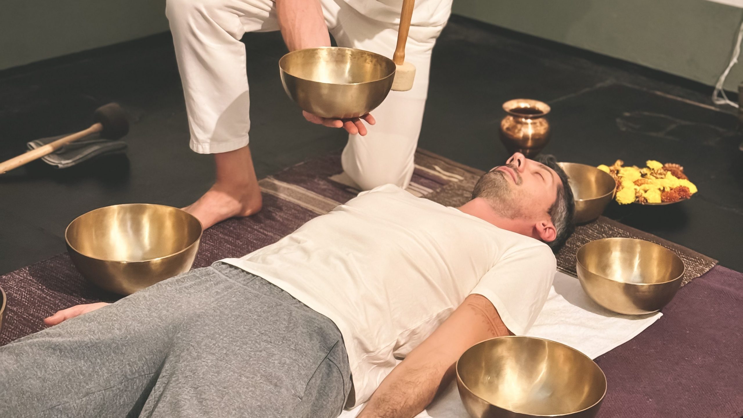Sound Healing participant resting in Sarvasana